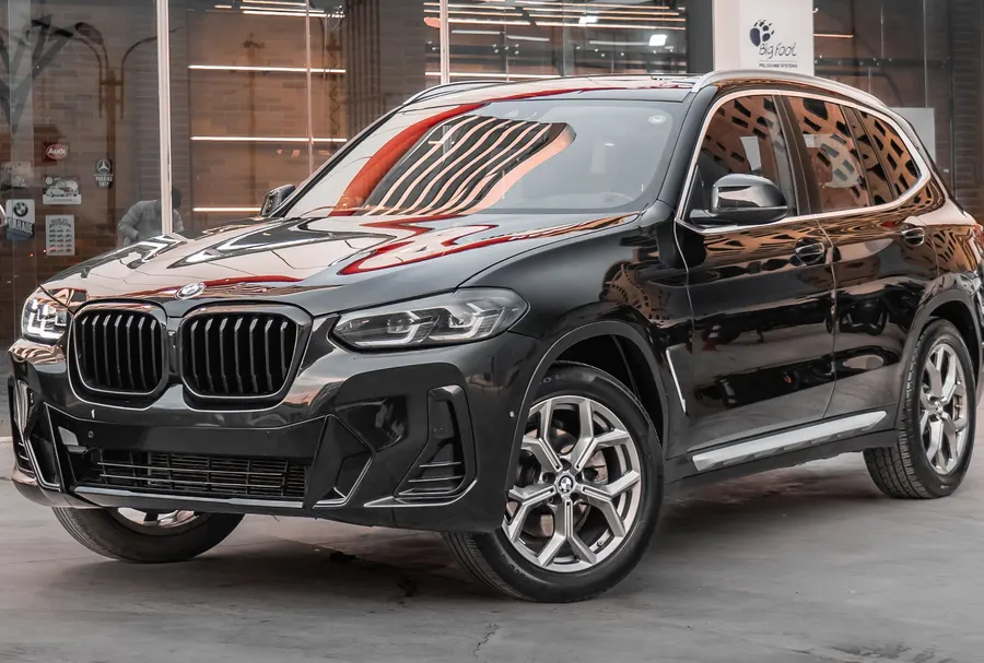 2024 BMW X3 xDrive30i used-car listing being scanned by CarVitals